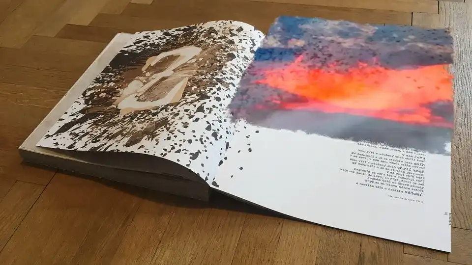 A splatter-printed page numbered 3 beside its lyrics, with a red-and-blue sky rising off the paper as an augmented panel.